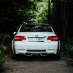 white BMW near trees