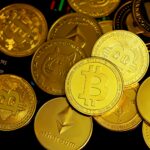 a pile of gold bitcoins sitting on top of each other