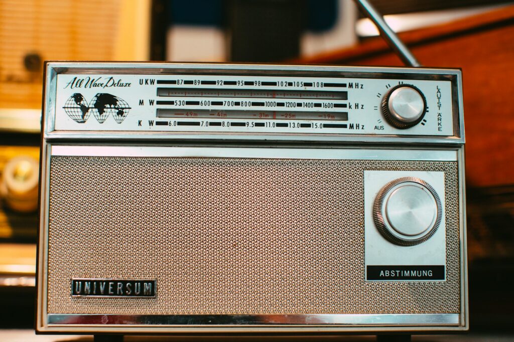 an old radio sitting on top of a table